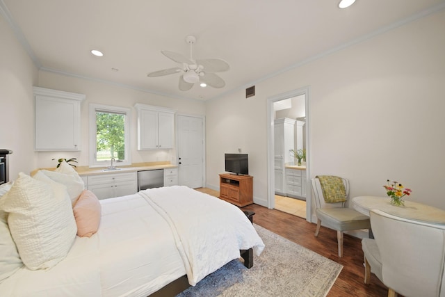 7527 Foster Island Dr, Richmond, TX 77406 - bedroom featuring recessed lighting, ornamental molding, dark wood-type flooring, a sink, and connected bathroom