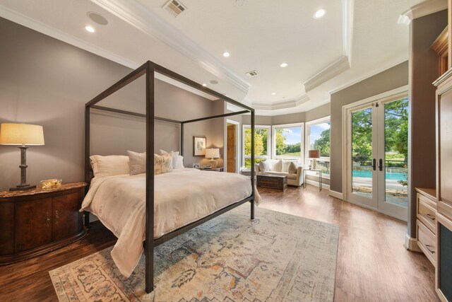 7527 Foster Island Dr, Richmond, TX 77406 - bedroom with crown molding, access to exterior, french doors, wood finished floors, and a raised ceiling