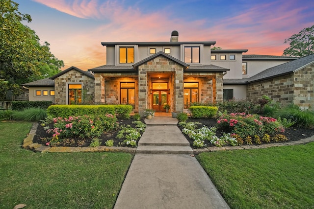 7527 Foster Island Dr, Richmond, TX 77406 - view of front of property with stone siding, a lawn, a chimney, and stucco siding