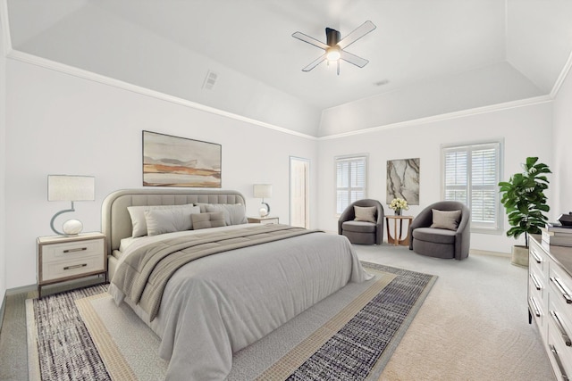 bedroom featuring light colored carpet, vaulted ceiling, and a ceiling fan
