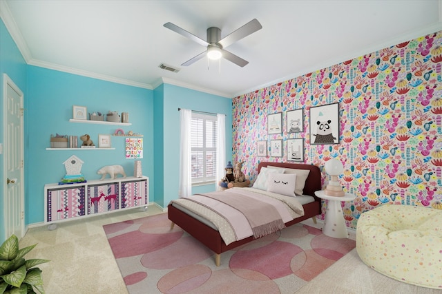 carpeted bedroom featuring ornamental molding, ceiling fan, and baseboards