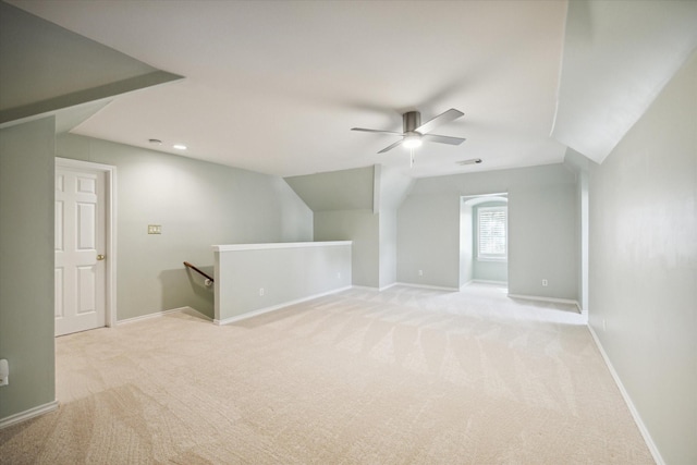 bonus room featuring light colored carpet, ceiling fan, baseboards, and vaulted ceiling