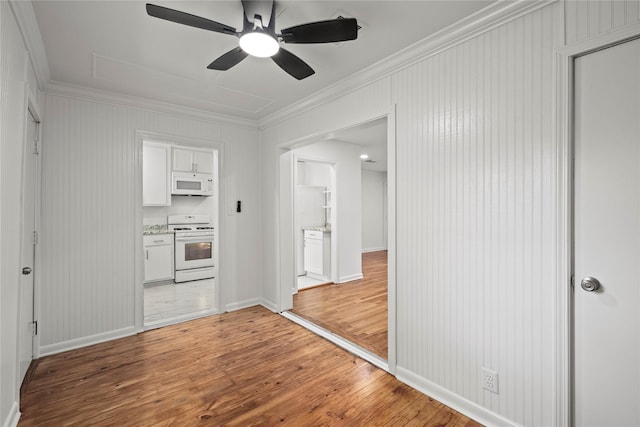 5023 Hull St, Houston, TX 77021 - unfurnished room with ornamental molding, light wood finished floors, ceiling fan, attic access, and baseboards