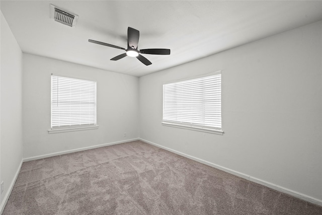 5023 Hull St, Houston, TX 77021 - spare room with carpet floors, ceiling fan, and baseboards