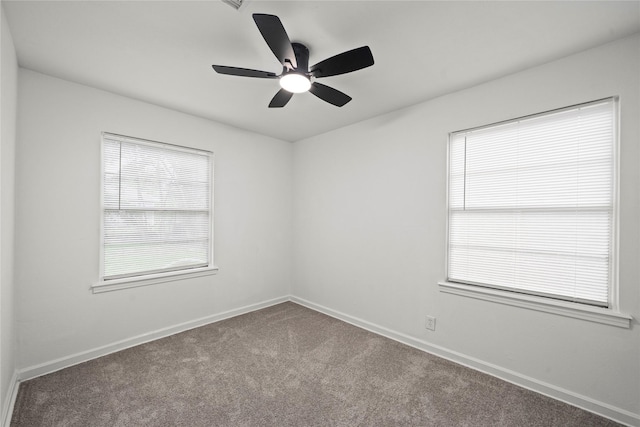 5023 Hull St, Houston, TX 77021 - carpeted empty room featuring baseboards and a ceiling fan
