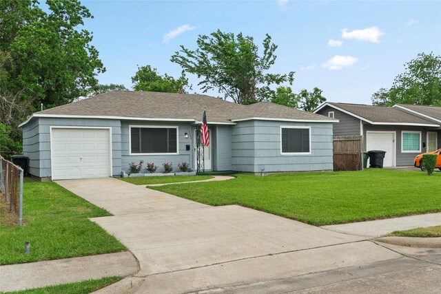 5023 Hull St, Houston, TX 77021 - ranch-style house with concrete driveway, a shingled roof, and an attached garage