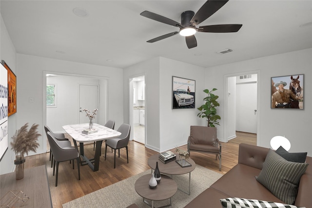 5023 Hull St, Houston, TX 77021 - living room featuring wood finished floors, baseboards, and a ceiling fan
