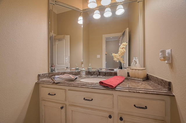 18518 W Paloma Lago Cir, Cypress, TX 77433 - bathroom with vanity and a textured wall