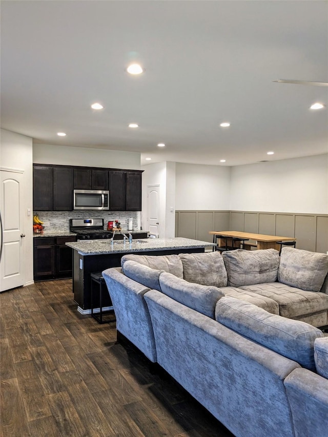 18475 Tenaha Mill Dr, New Caney, TX 77357 - living room featuring dark wood finished floors and recessed lighting