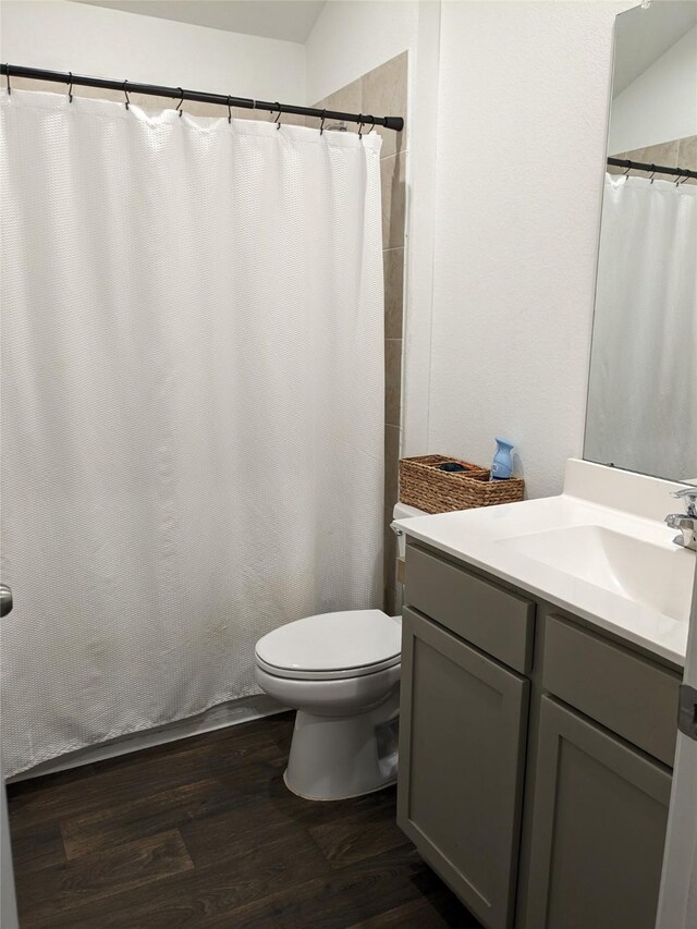 18475 Tenaha Mill Dr, New Caney, TX 77357 - full bathroom with toilet, wood finished floors, and vanity