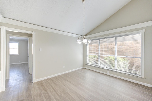2036 Woodland Hills Dr, Missouri City, TX 77489 - spare room featuring a chandelier, light wood-style flooring, lofted ceiling, baseboards, and ornamental molding