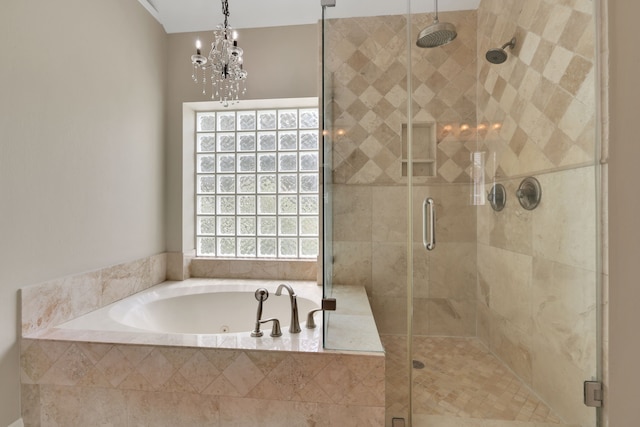 bathroom featuring a garden tub and a shower stall