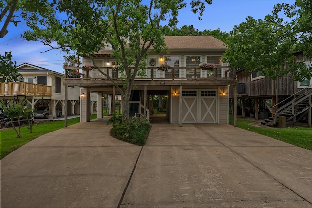 268 Seminole Dr, League City, TX 77565 - beach home featuring a carport, driveway, and stairs