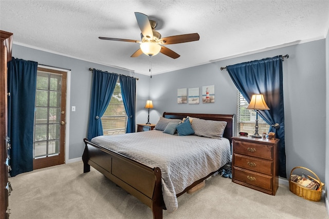 268 Seminole Dr, League City, TX 77565 - bedroom featuring carpet, multiple windows, a textured ceiling, baseboards, and a ceiling fan