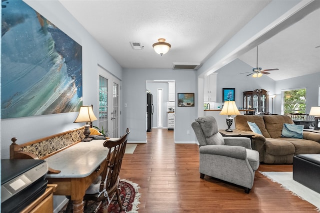 268 Seminole Dr, League City, TX 77565 - living room featuring wood finished floors, a ceiling fan, baseboards, and a textured ceiling