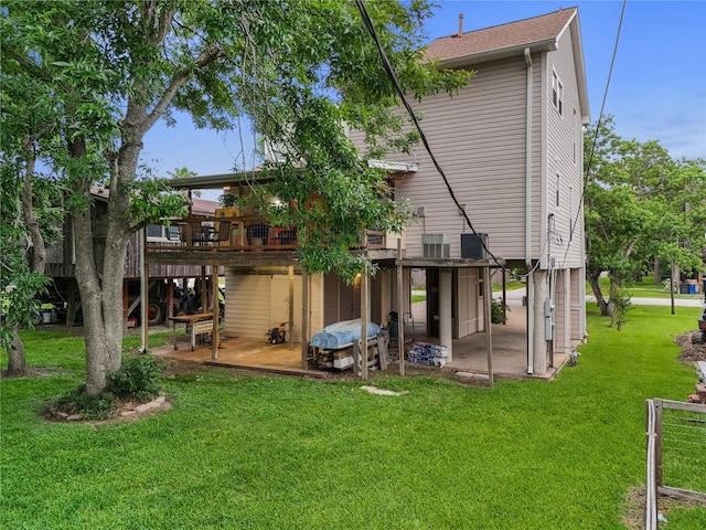 268 Seminole Dr, League City, TX 77565 - back of house featuring a deck, a yard, a patio, and roof with shingles