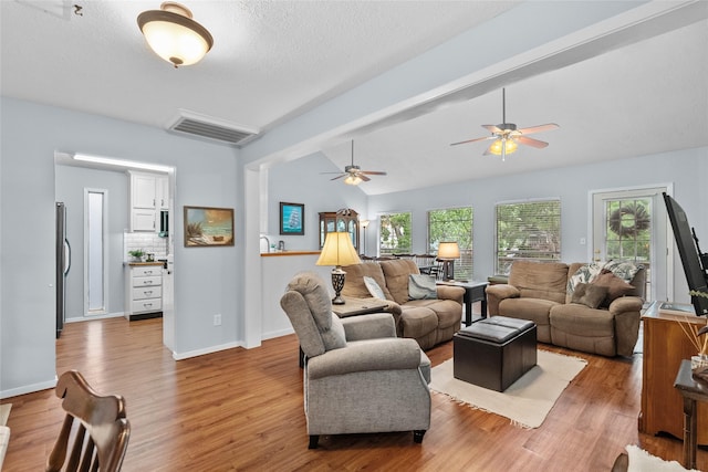268 Seminole Dr, League City, TX 77565 - living area with light wood-style flooring, a ceiling fan, and baseboards