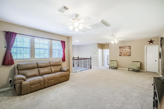 23915 Travis Trl, Katy, TX 77494 - living area with attic access, a ceiling fan, carpet flooring, and baseboards