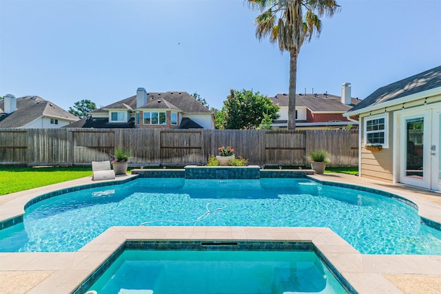 23915 Travis Trl, Katy, TX 77494 - view of swimming pool with a fenced backyard and french doors