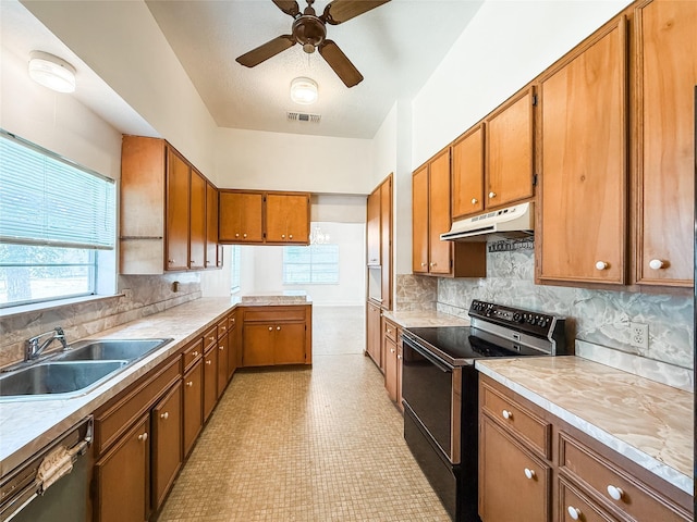 102 Besch Wilburn Ln, Glidden, TX 78943 - kitchen with black range with electric stovetop, under cabinet range hood, a sink, dishwashing machine, and brown cabinetry