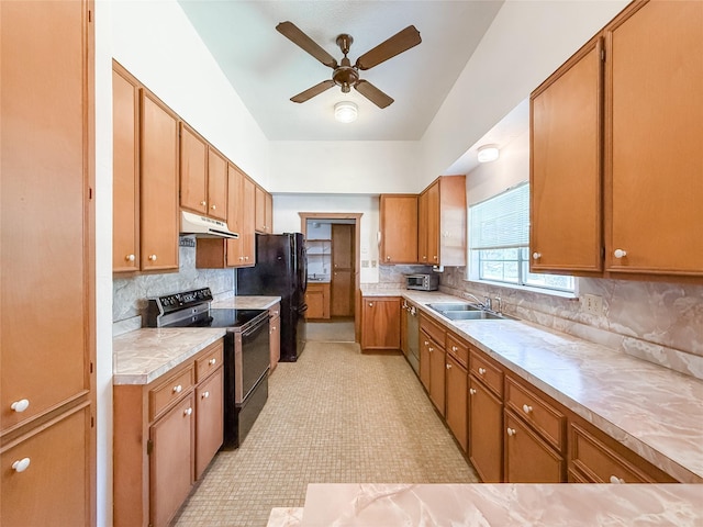 102 Besch Wilburn Ln, Glidden, TX 78943 - kitchen featuring black appliances, under cabinet range hood, a ceiling fan, light countertops, and a sink