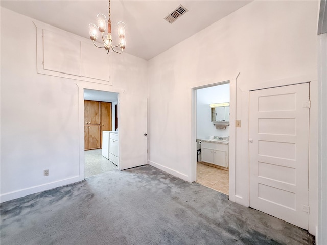 102 Besch Wilburn Ln, Glidden, TX 78943 - unfurnished room with baseboards, carpet, a chandelier, independent washer and dryer, and a high ceiling