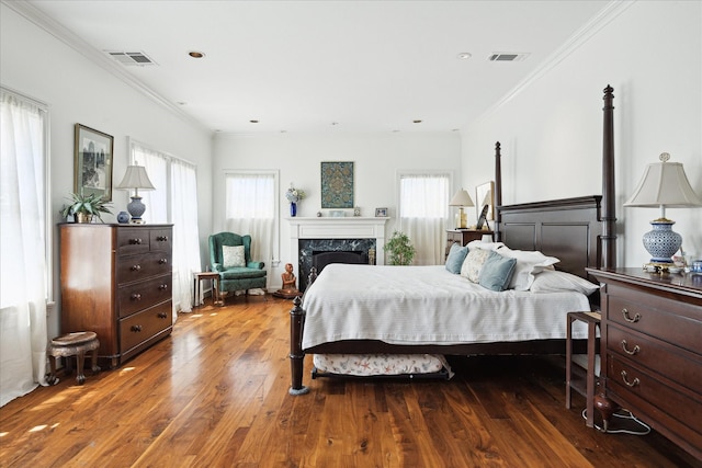 1755 Kipling St, Houston, TX 77098 - bedroom featuring wood finished floors, ornamental molding, and a high end fireplace