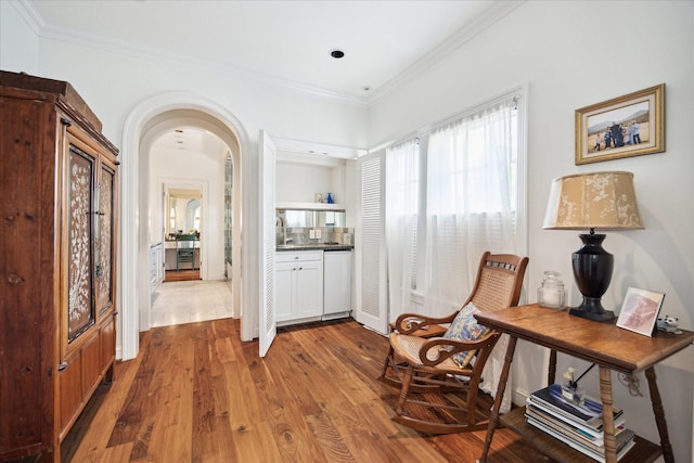 1755 Kipling St, Houston, TX 77098 - sitting room with wood finished floors, ornamental molding, and arched walkways
