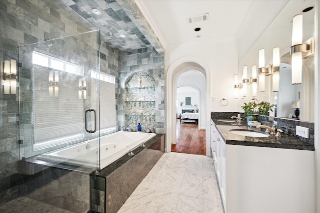 1755 Kipling St, Houston, TX 77098 - bathroom featuring ornamental molding, ensuite bathroom, a stall shower, a garden tub, and double vanity