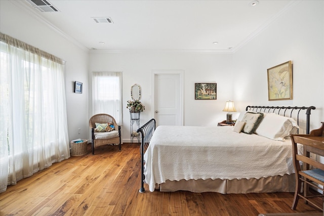 1755 Kipling St, Houston, TX 77098 - bedroom featuring crown molding and light wood finished floors