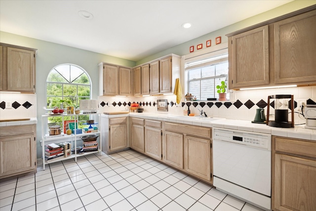 1755 Kipling St, Houston, TX 77098 - kitchen featuring dishwasher, a sink, decorative backsplash, light brown cabinets, and recessed lighting