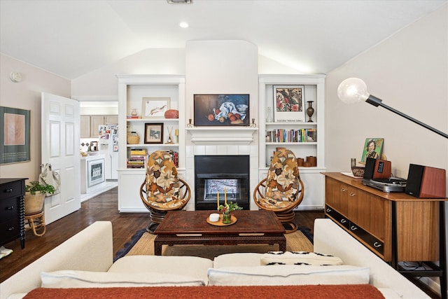 1755 Kipling St, Houston, TX 77098 - living area with vaulted ceiling, wood finished floors, and a tile fireplace