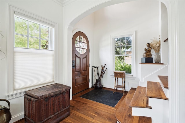 1755 Kipling St, Houston, TX 77098 - entrance foyer with arched walkways and dark wood-style floors