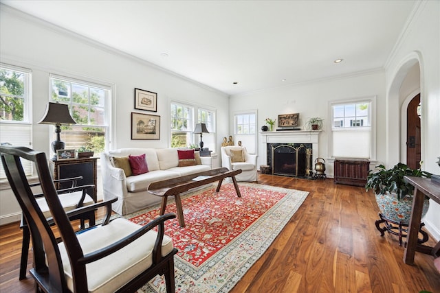 1755 Kipling St, Houston, TX 77098 - living room with plenty of natural light, ornamental molding, arched walkways, wood finished floors, and a high end fireplace