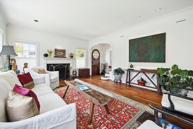 1755 Kipling St, Houston, TX 77098 - living area with arched walkways, wood finished floors, ornamental molding, and a high end fireplace