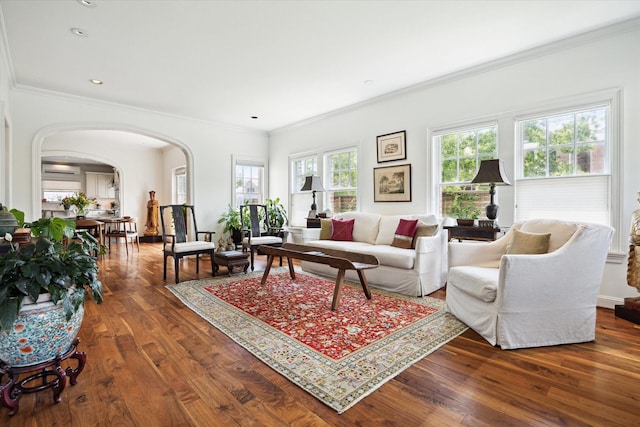 1755 Kipling St, Houston, TX 77098 - living area with arched walkways, wood finished floors, and ornamental molding