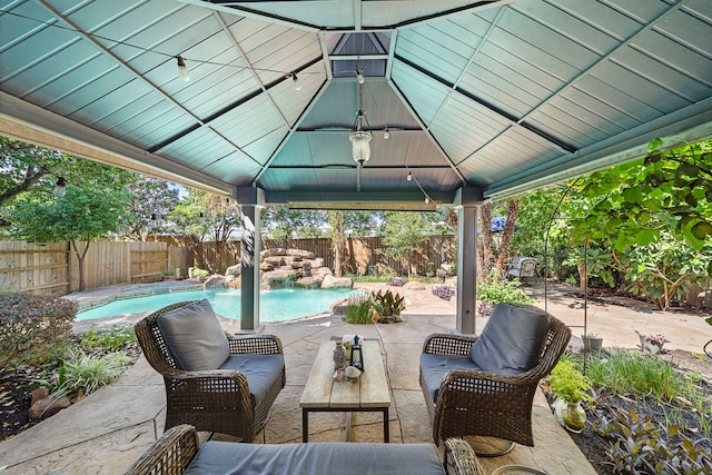 view of patio / terrace with a gazebo, a fenced backyard, and an outdoor hangout area