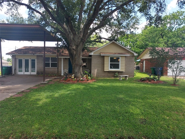 509 S Ramona St, Angleton, TX 77515 - single story home with brick siding, a front yard, and french doors