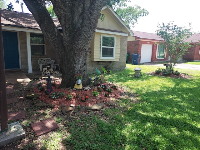 509 S Ramona St, Angleton, TX 77515 - view of side of property with brick siding, a garage, and a yard