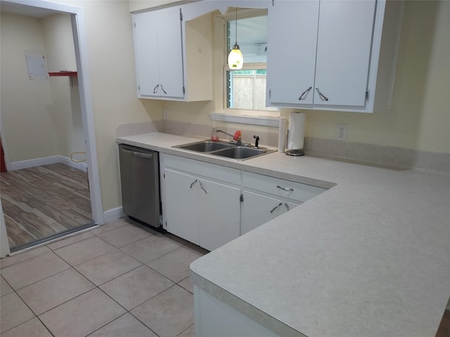 509 S Ramona St, Angleton, TX 77515 - kitchen featuring dishwasher, a sink, light countertops, white cabinets, and baseboards