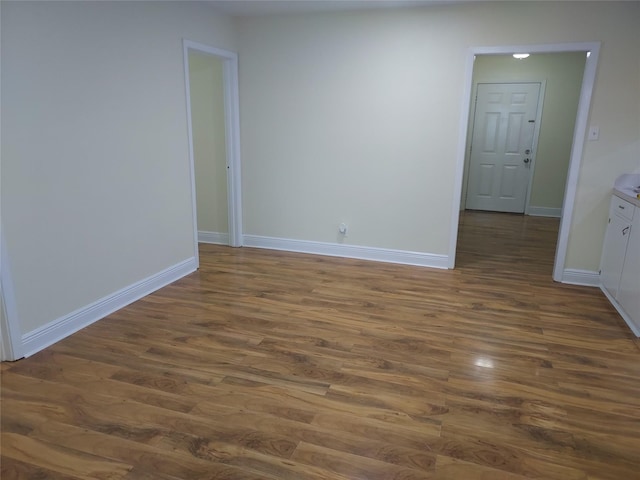 509 S Ramona St, Angleton, TX 77515 - unfurnished room with dark wood-type flooring and baseboards