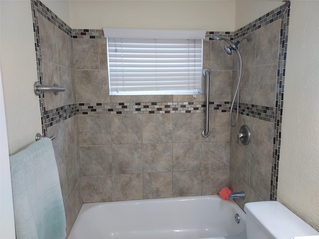 509 S Ramona St, Angleton, TX 77515 - bathroom with shower / bathtub combination, toilet, and a textured wall