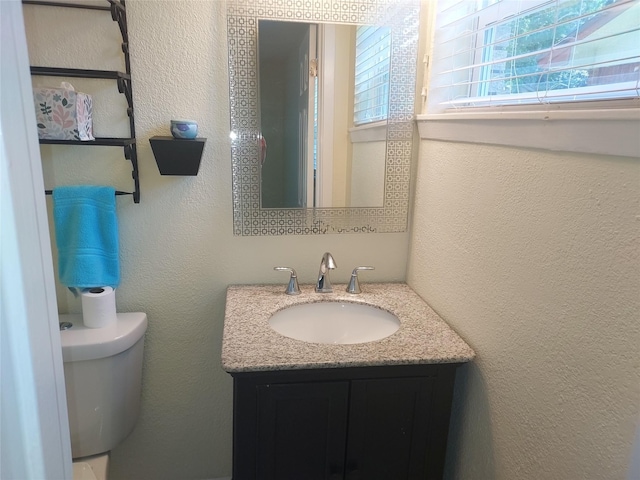 509 S Ramona St, Angleton, TX 77515 - half bathroom with vanity, toilet, and a textured wall
