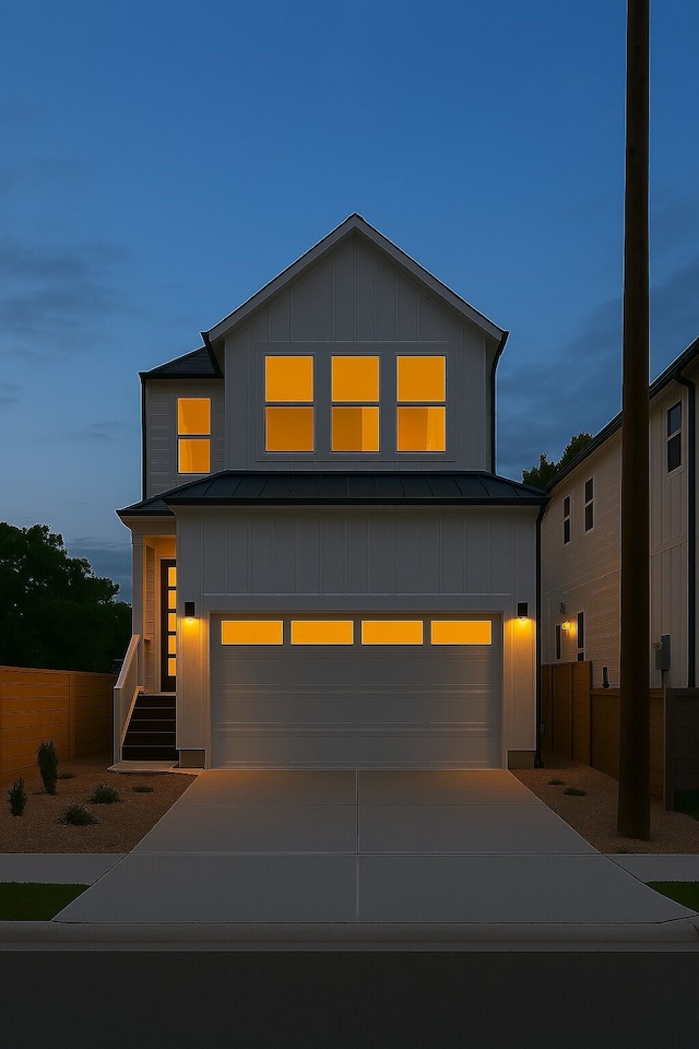 3224 Omega St, Houston, TX 77022 - view of front facade with an attached garage, a standing seam roof, metal roof, and board and batten siding