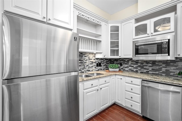 6728 Buffalo Speedway, West University Place, TX 77005 - kitchen featuring stainless steel appliances, a sink, dark wood finished floors, glass insert cabinets, and tasteful backsplash