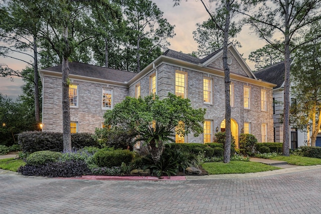 view of front of home with brick siding
