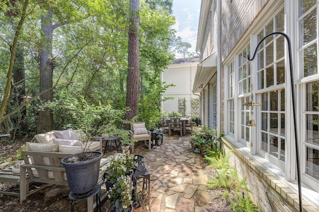 view of patio / terrace with outdoor dining area and an outdoor hangout area