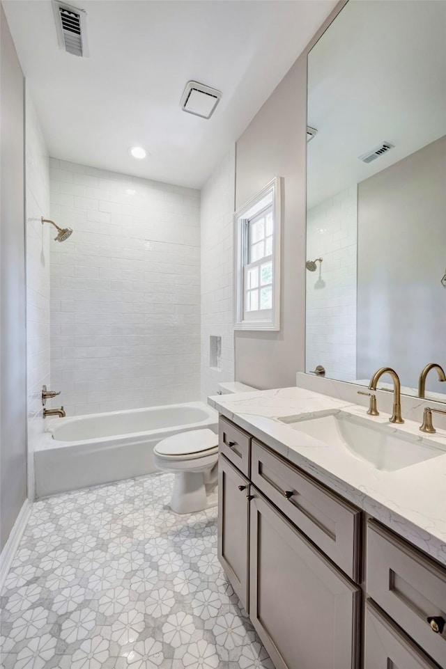 bathroom featuring toilet, shower / tub combination, and vanity