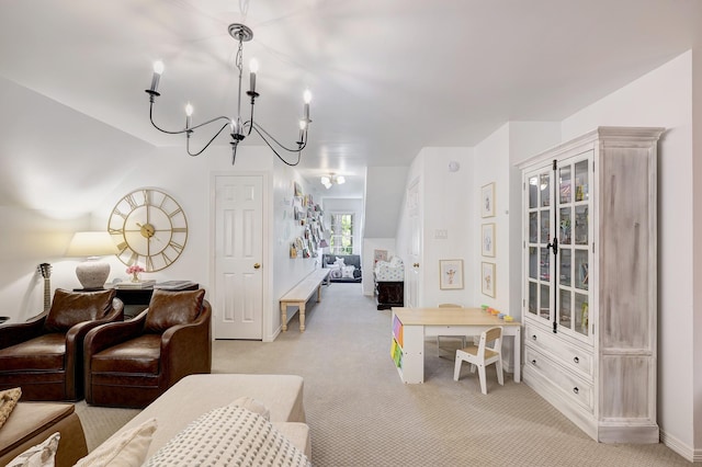 living area with light carpet, a chandelier, and baseboards
