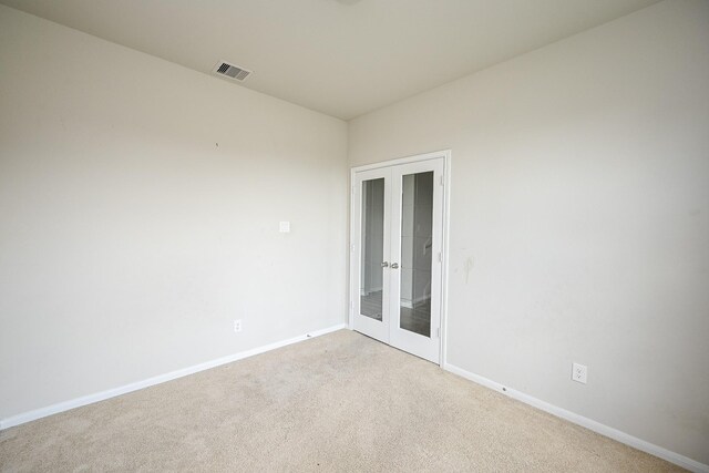 108 Shallow Creek Dr, Waller, TX 77445 - carpeted empty room featuring french doors and baseboards